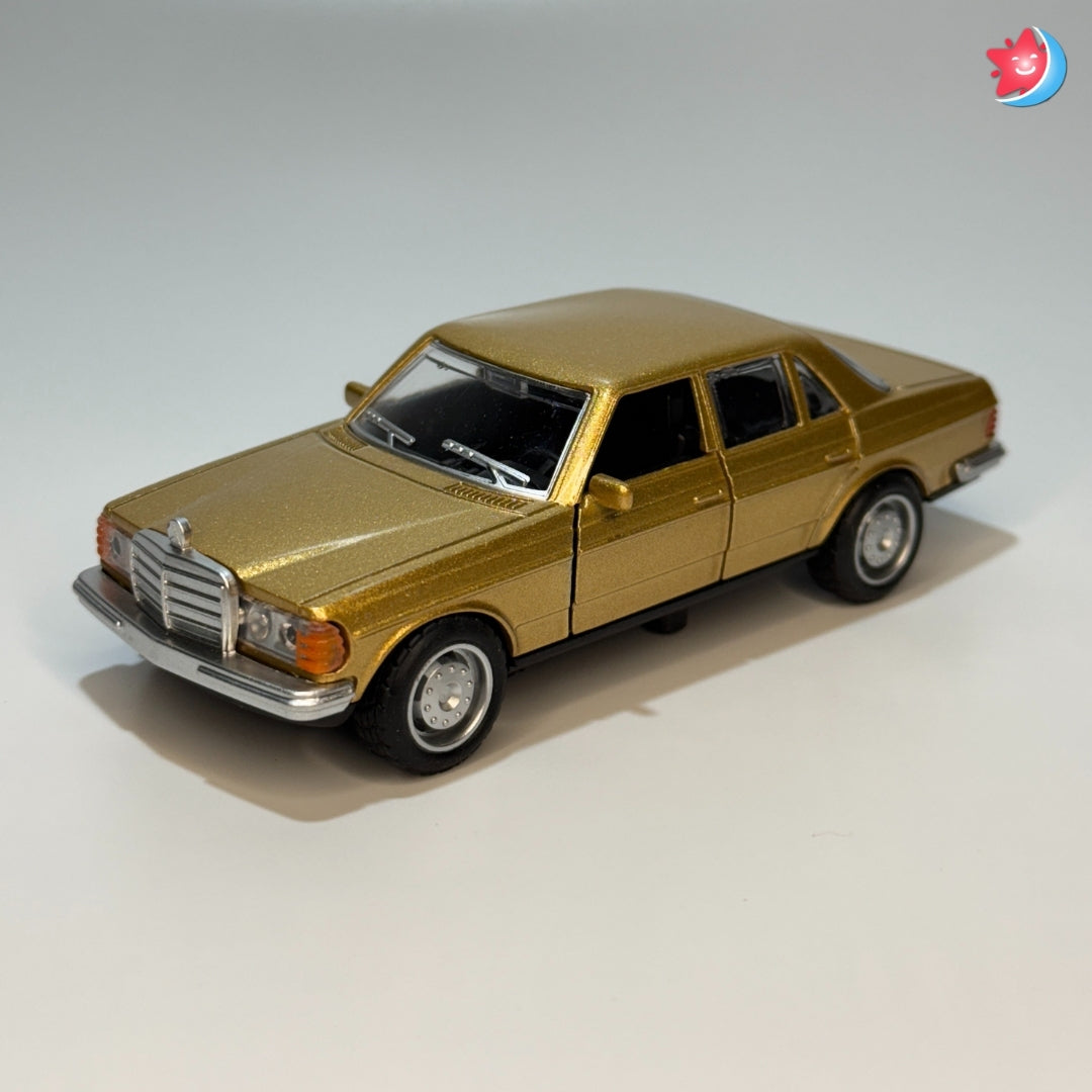 Gold Mercedes Benz model car on a light gray background
