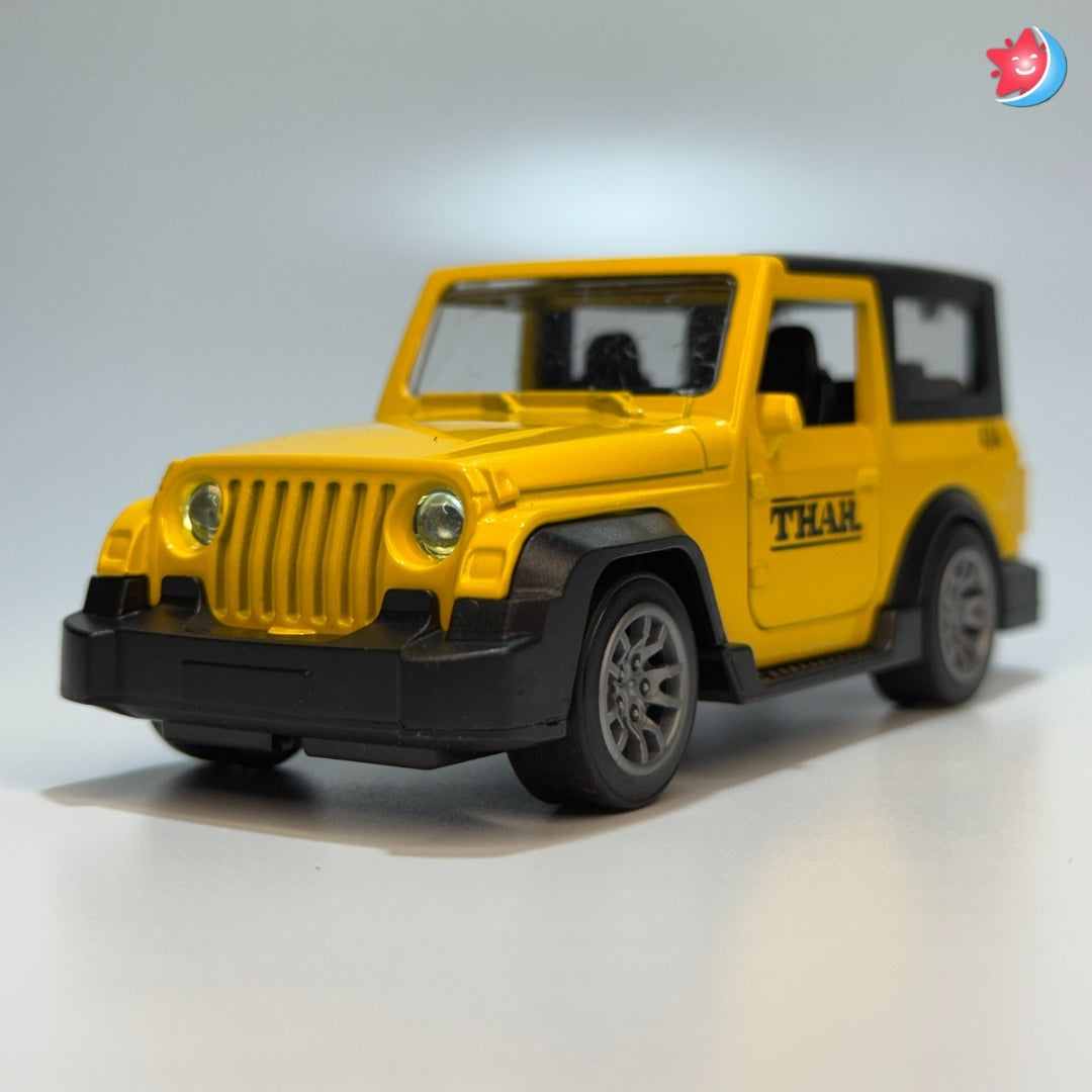 Yellow toy jeep with 'THAR' branding on a gray background